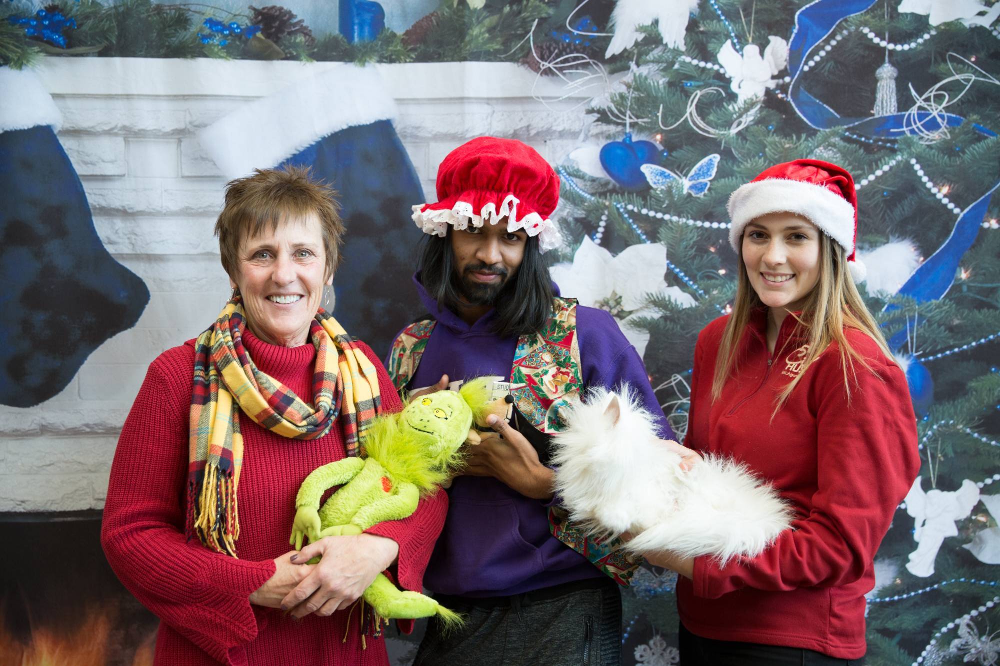 3 employees of office of student life wearing Christmas clothes
